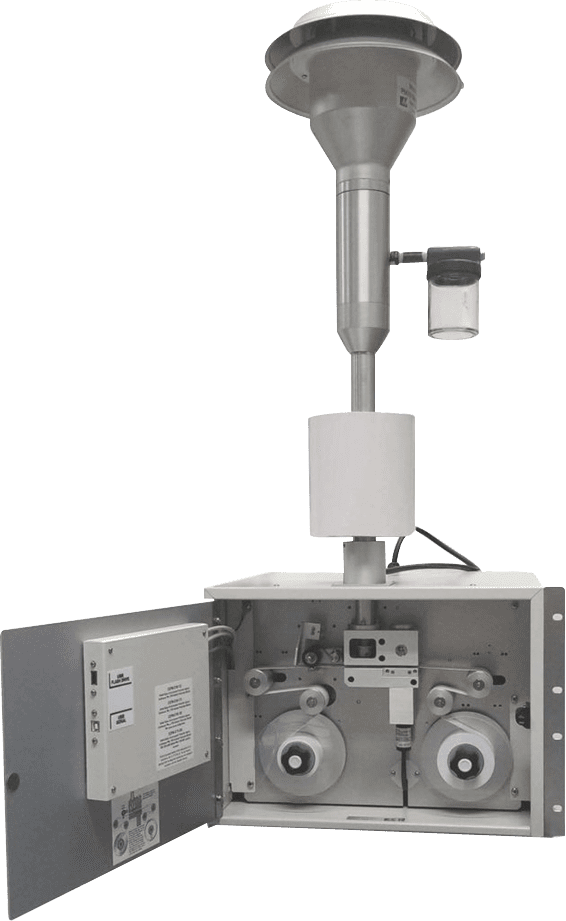BAM-1020-Continuous-Particulate-Monitor-1 A scientific instrument with a cylindrical funnel and an open compartment containing spools and digital controls.